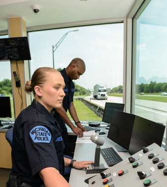 Motor Carrier Officers checking truck weight
