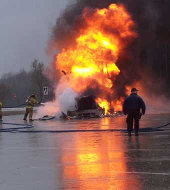 Motor Carrier Officer helping with truck fire