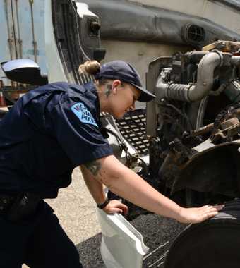 Motor Carrier Officer checking truck